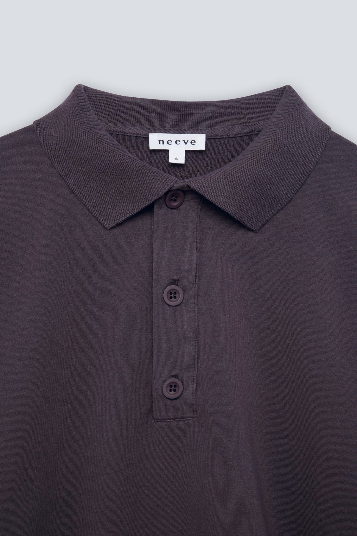 The Remi in Plum. Polo long sleeve with a boxy shape. Made from 100% organic cotton babyfleece. Collar detail.