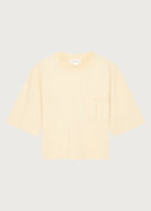 The Tess dropped shoulder tee in apricot front view, pocket detail, 180g organic cotton made in Portugal

