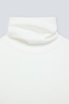 The Theresa in Off-White. Ribbed Turtleneck. 95% organic cotton with 5% elastane. GOTS. collar detail. 