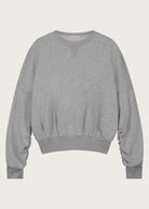 The Blake cropped sweatshirt in grey melange front view, twisted sleeve detail, organic cotton fleece
