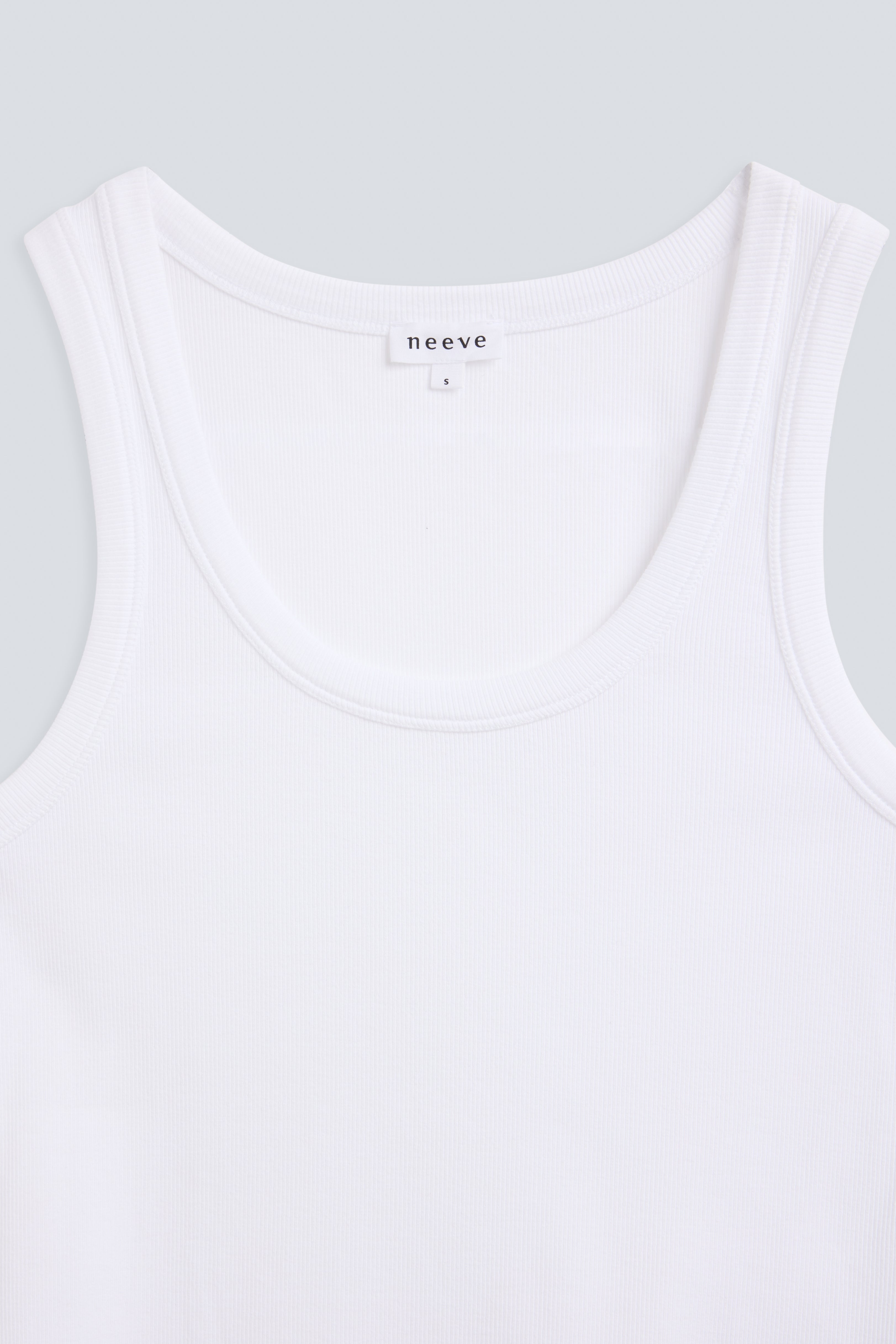The Josie organic cotton tank top in crispy white, detail front. GOTS-certified