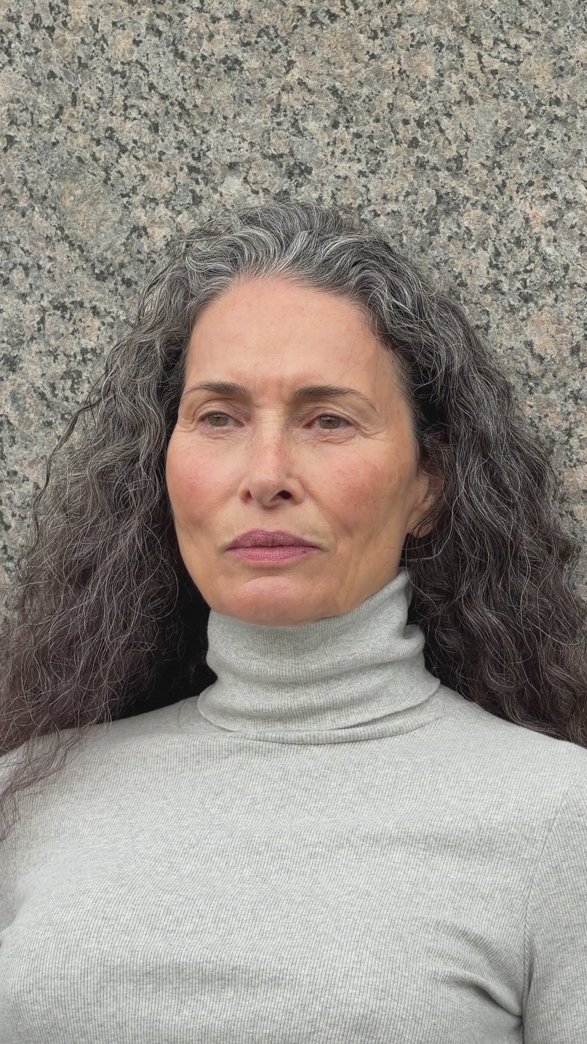 The Theresa in Grey Melange. A ribbed turtleneck cut from 95% organic cotton with 5% elastane. Shown on model. 