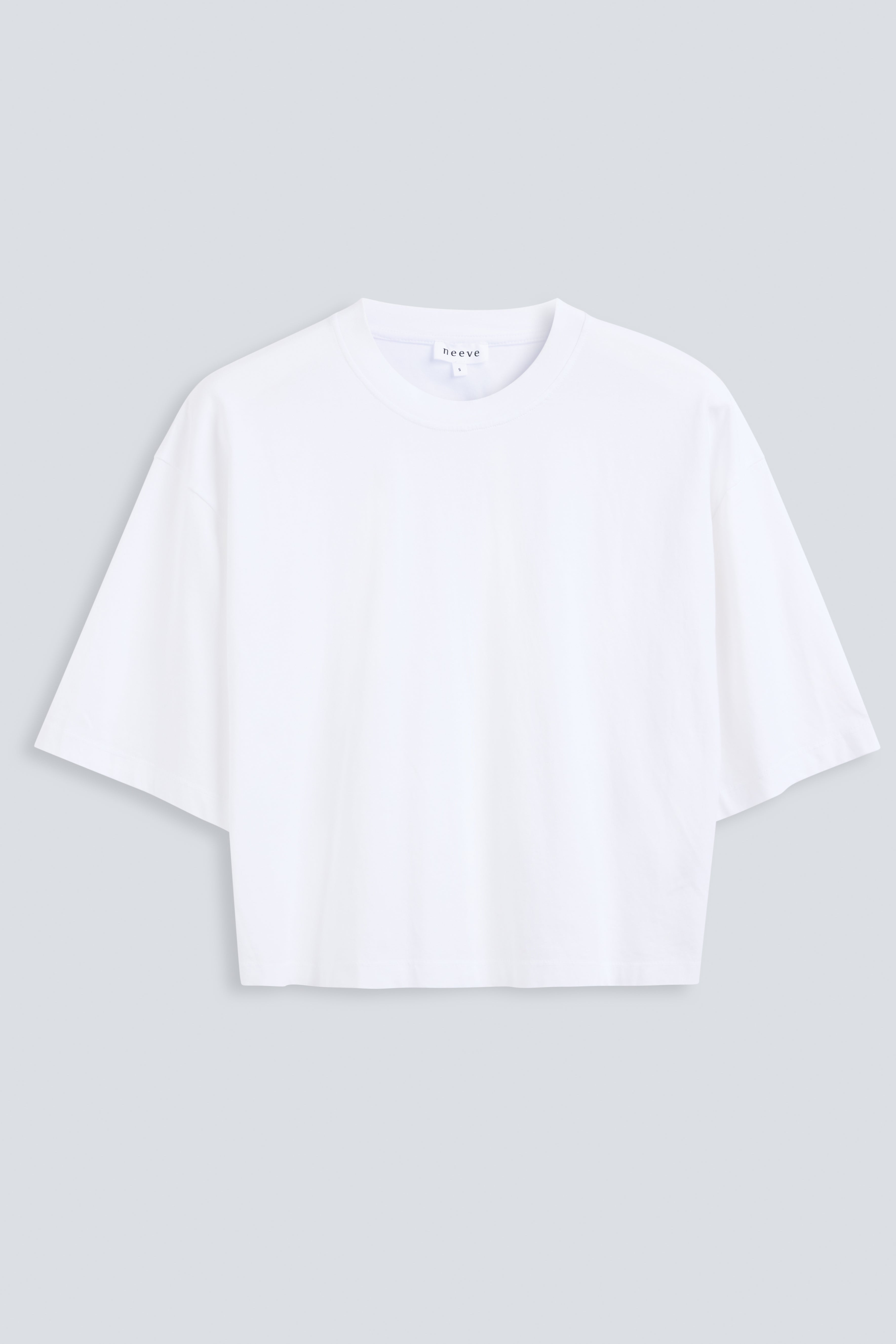 The Talia in Crispy White. Front view. Dropped shoulders and mid-length sleeves, 180g, 100% organic cotton made in Portugal. GOTS