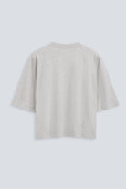 The Talia in Grey Melange. Back view. Dropped shoulders and mid-length sleeves, 180g, 100% organic cotton made in Portugal. GOTS