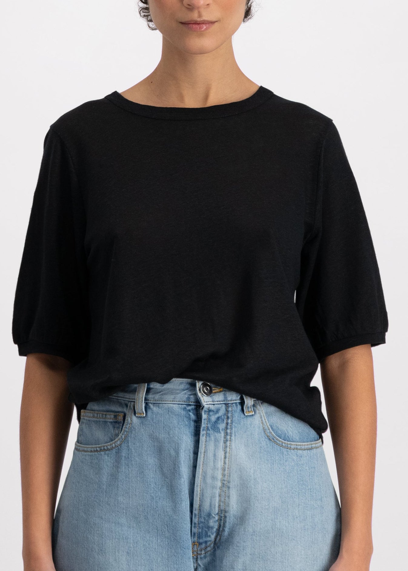 The Billie linen top in essential black on model, mid-sleeve crew neck, 100% linen made in Portugal